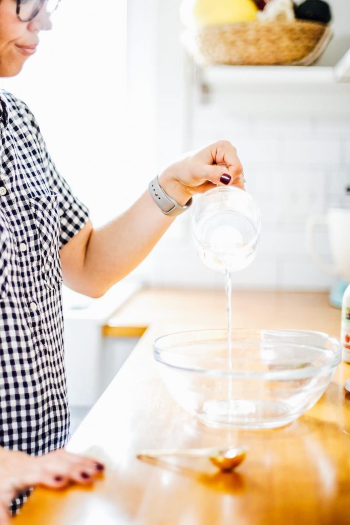 Pouring water into a bowl to make marshmallows