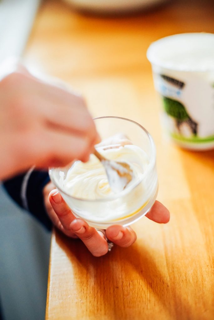 Stirring yogurt to make a mask