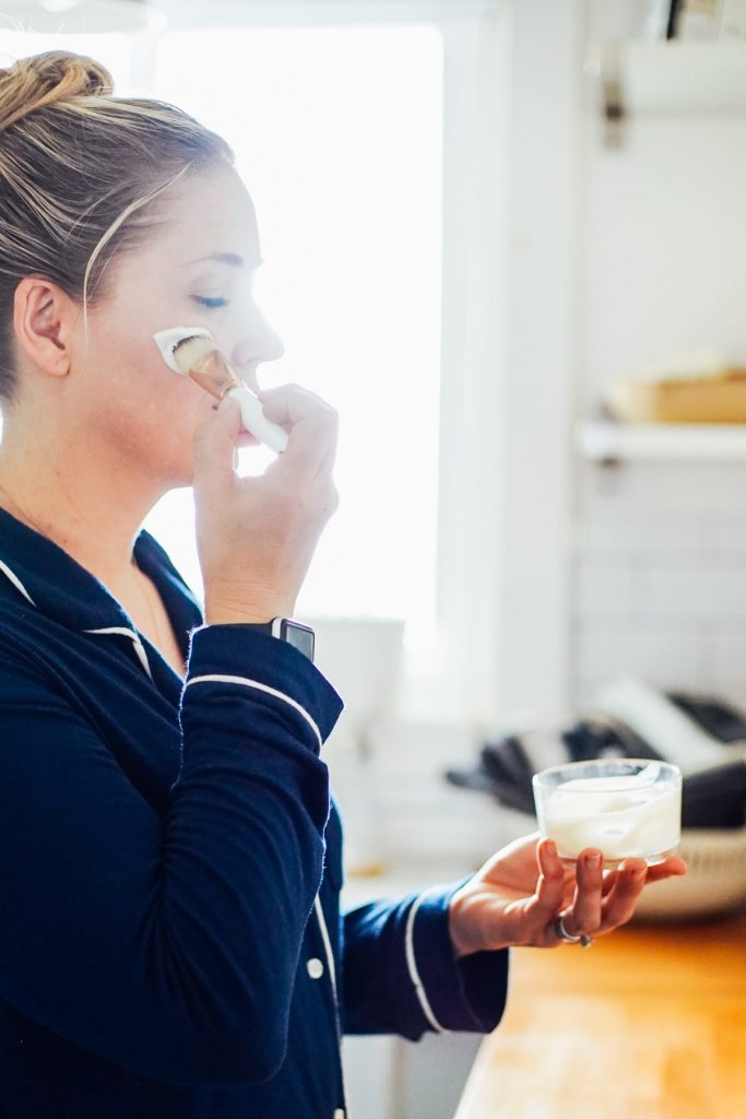 applying yogurt to face