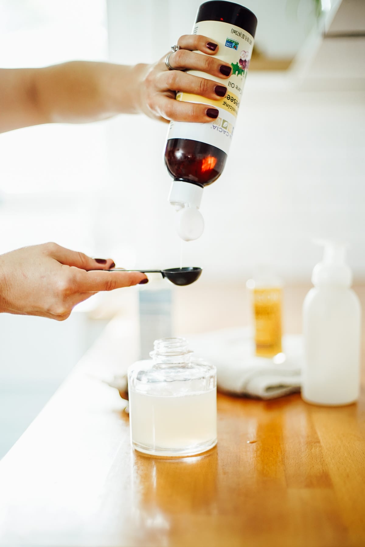 Adding oil to hand soap dispenser