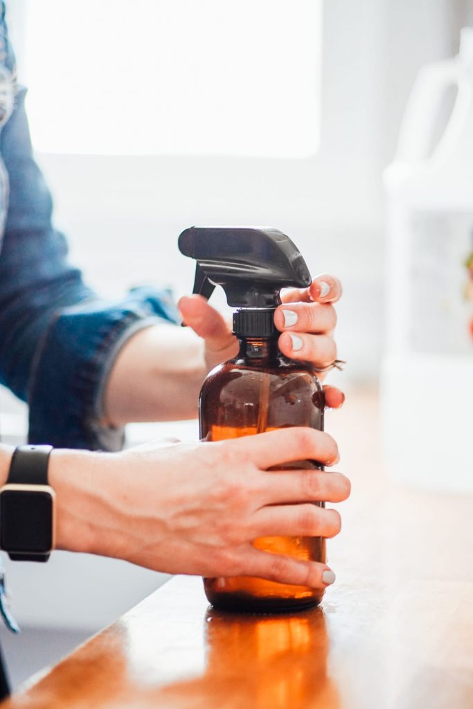 putting top on spray bottle after making all purpose cleaner