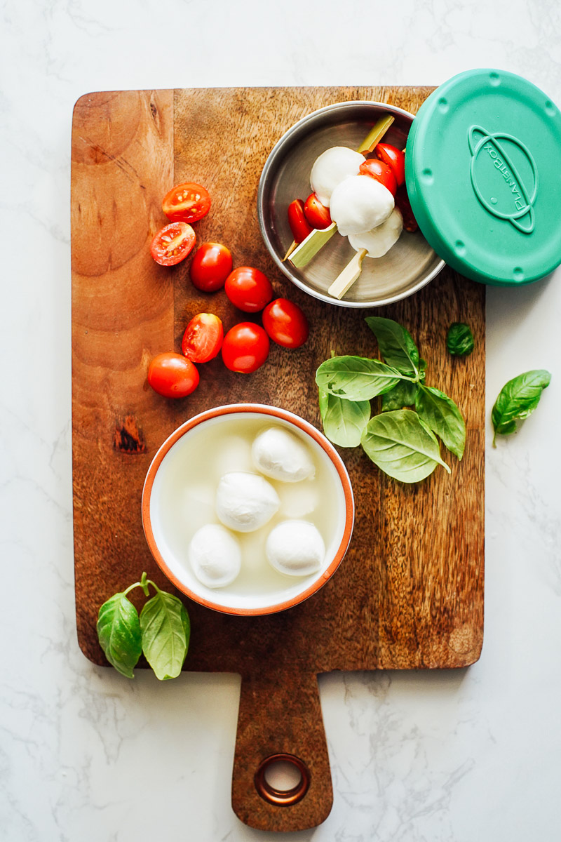 Cherry tomatoes and mozzarella cheese on skewers.