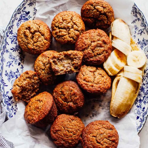 Banana muffins on a blue and white serving plate.