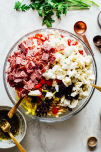 All pasta salad ingredients in a large mixing bowl.
