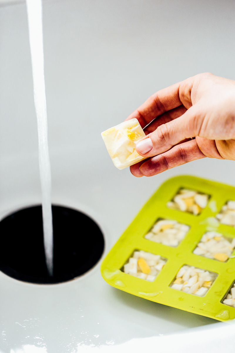 Homemade garbage disposal tabs made with orange peel concentrate and orange peels.