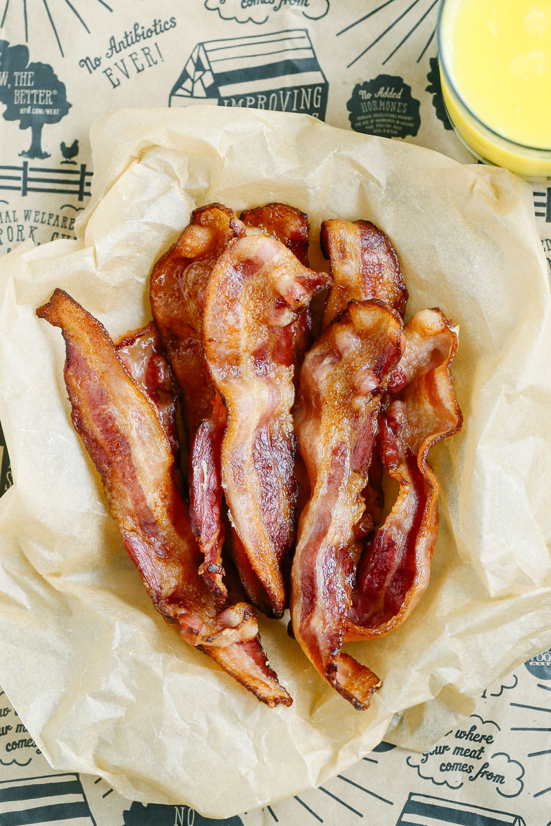 Cooked bacon on parchment paper.