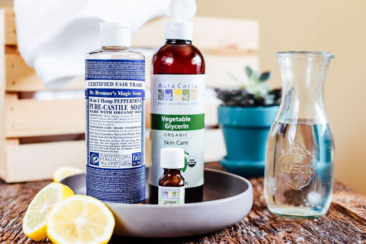 Ingredients to make a stain remover: glycerin, castile soap, water, and lemon essential oil.