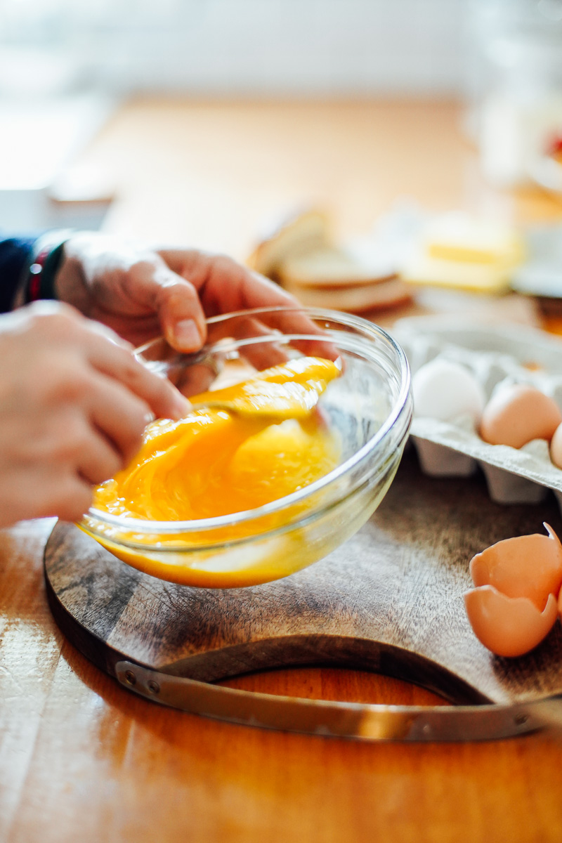Whisking eggs in a small bowl.