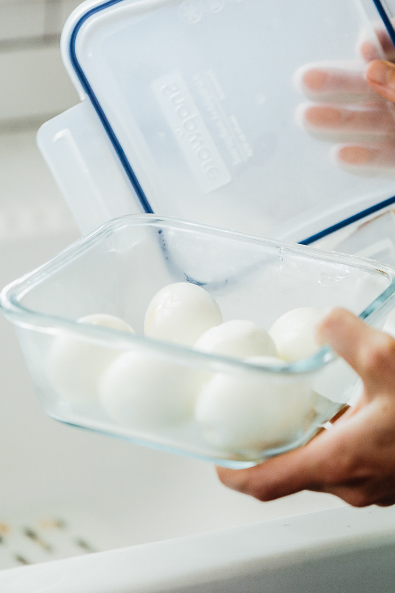 Hardboiled eggs, peeled, in an airtight container. 