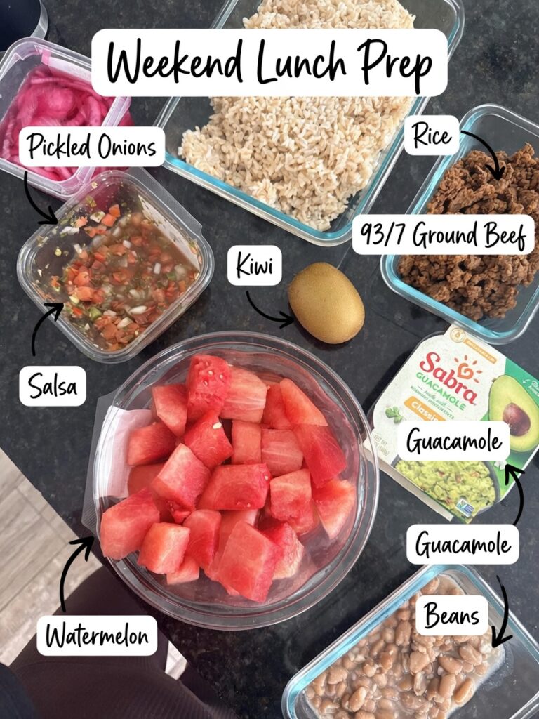 Weekend meal prep containers with rice, 93/7 ground beef, beans, salsa, pickled onions, watermelon, guacamole, and kiwi ready for the week
